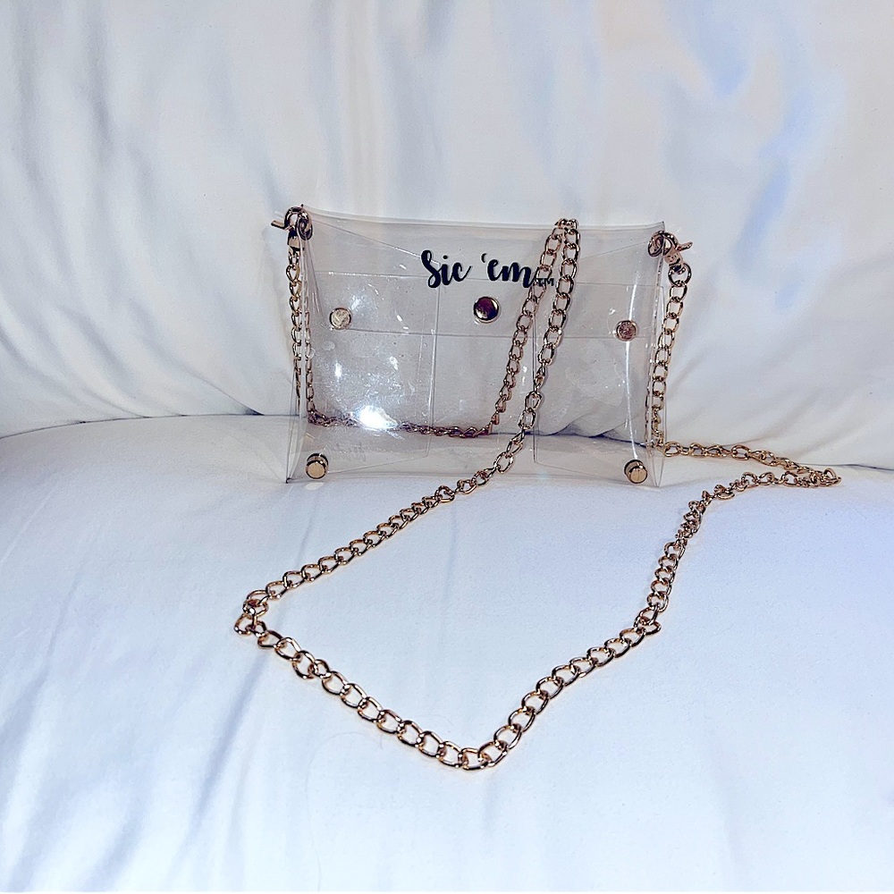 NWOT Darden Baylor “Sic ‘em” clear bag on gold chain